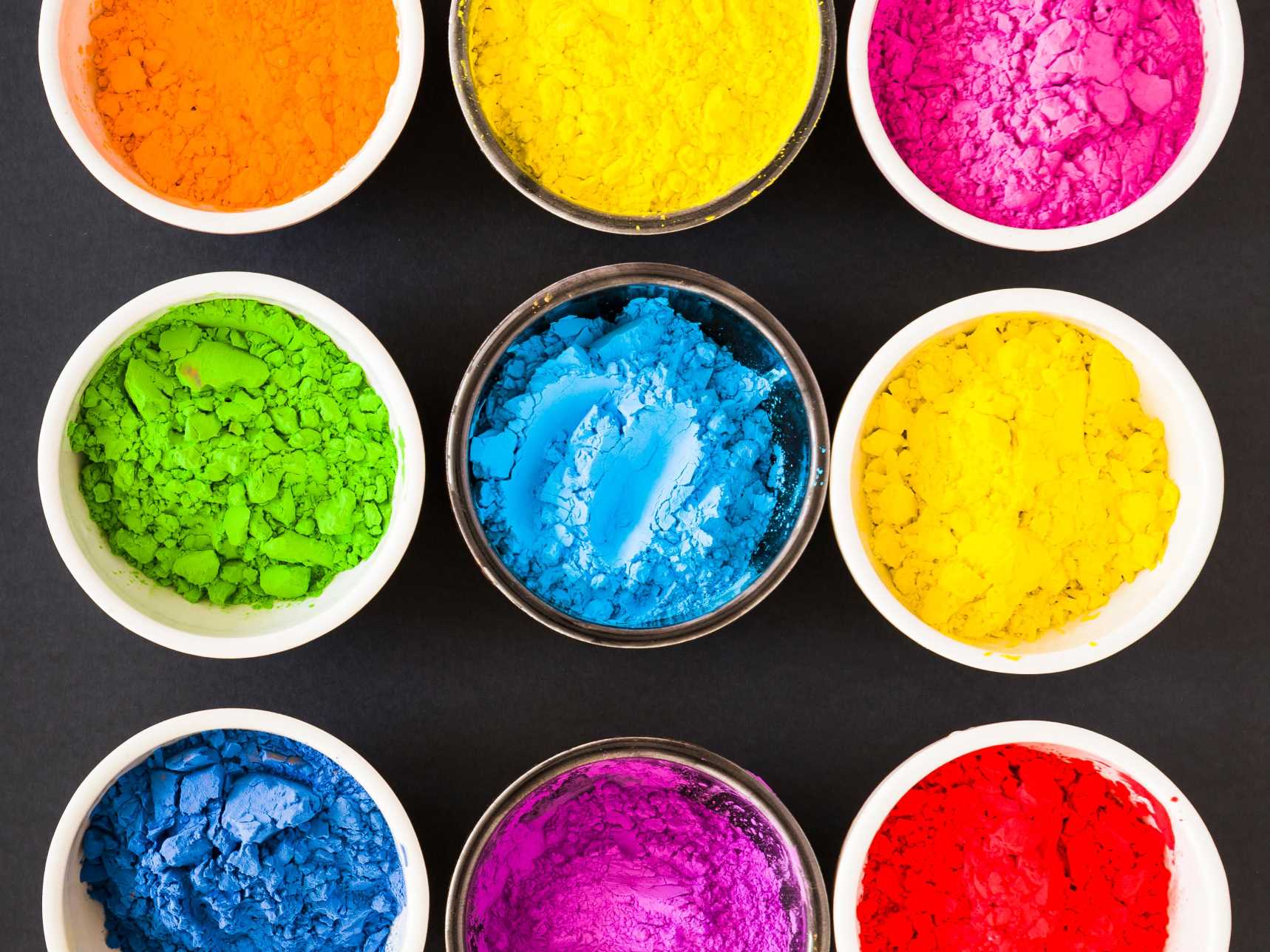 different-type-colorful-holi-powder-white-glass-bowl-black-backdrop.jpg